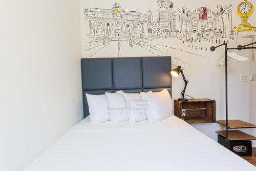 Habitación con cama grande del hotel JG Sohotel. Foto 3