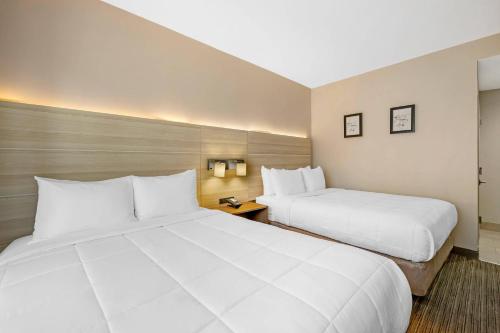 Habitación cuádruple con 2 camas grandes - No fumadores del hotel Country Inn & Suites by Radisson, Staten Island. Foto 3