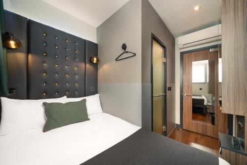 Habitación acogedora, individual, interior y cuenta con ventana del hotel Point A - Westminster, London. Foto 1