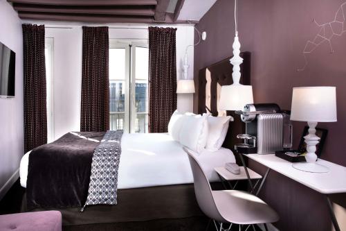Habitación Doble Deluxe con balcón del hotel Marais HÔme. Foto 1