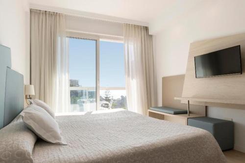 Habitación Doble con vistas parciales al mar del hotel Palia Las Palomas. Foto 3