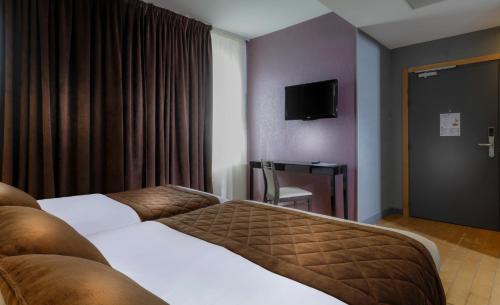 Habitación Triple adaptada para personas con movilidad reducida del hotel Ambre Hotel. Foto 1