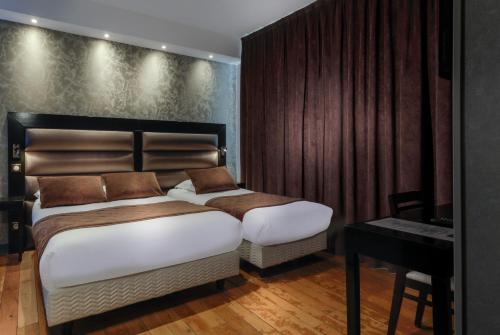 Habitación Triple adaptada para personas con movilidad reducida del hotel Ambre Hotel. Foto 4