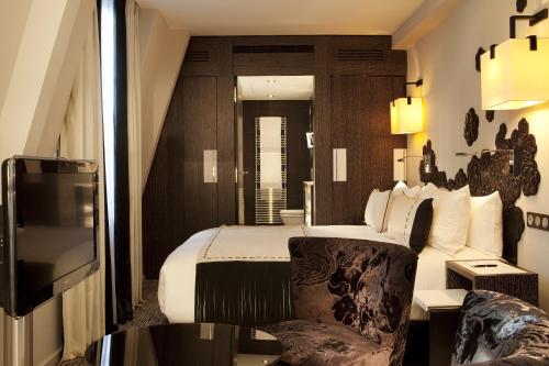 Suite Junior del hotel Les Jardins De La Villa Hotel. Foto 1