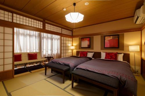 Habitación Doble para no fumadores con zona de tatami - 2 camas del hotel Oyado Koto No Yume. Foto 1