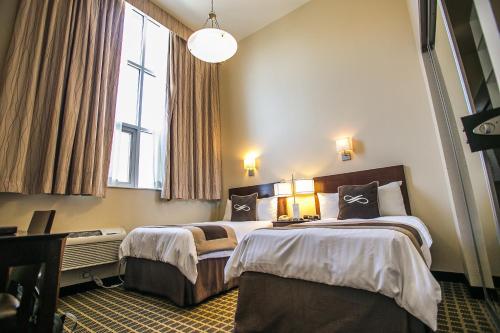 Habitación Doble Estándar - 2 camas del hotel Pointe Plaza. Foto 1