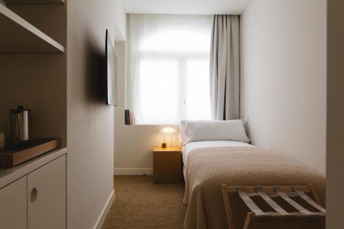 Habitación muy pequeña del hotel Casa Teva Rooms Sevilla. Foto 5