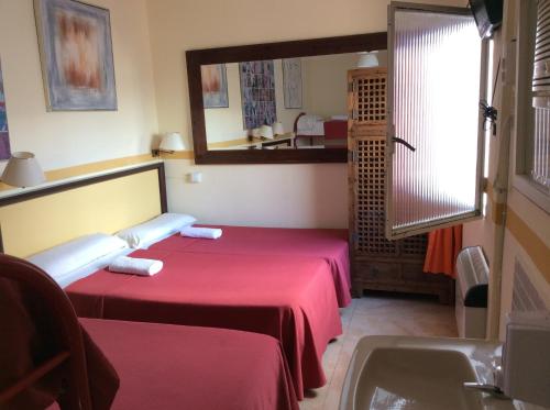 Habitación Cuádruple con baño compartido del hotel Nuevo Suizo