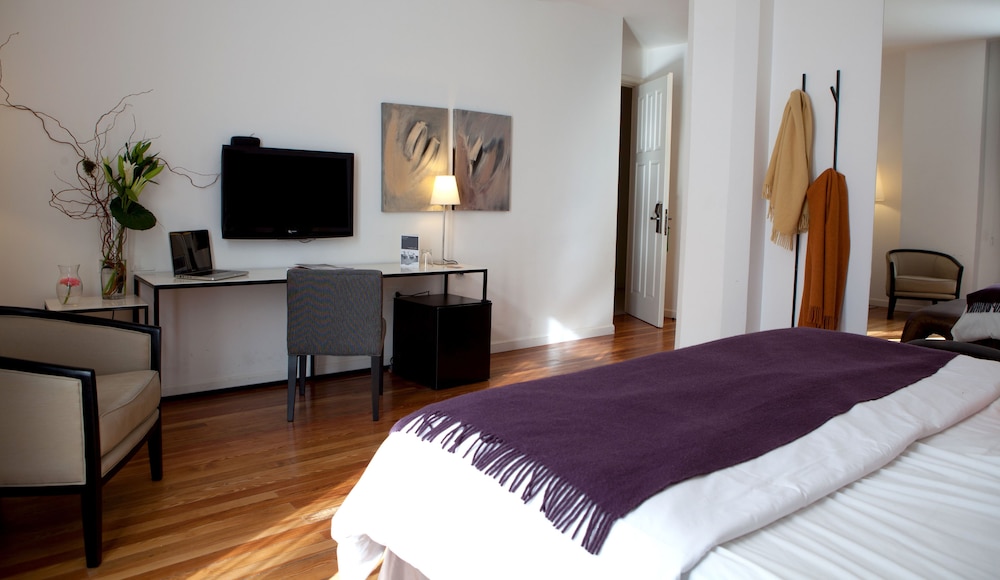 Suite, 1 cama de matrimonio grande, no fumadores del hotel Esplendor By Wyndham Montevideo Cervantes. Foto 2