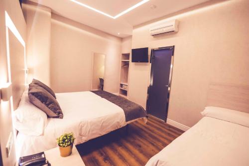 Habitación Triple del hotel Lisboa. Foto 4