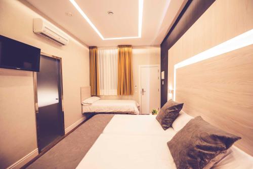 Habitación Triple del hotel Lisboa. Foto 5