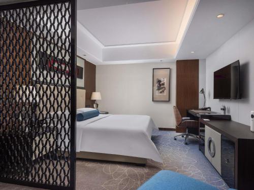 Habitación Clásica, 1 Cama King Size, Esquina del hotel Pullman Shanghai Jing An. Foto 1