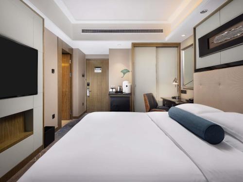 Habitación Clásica, 1 Cama King Size, Esquina del hotel Pullman Shanghai Jing An. Foto 2