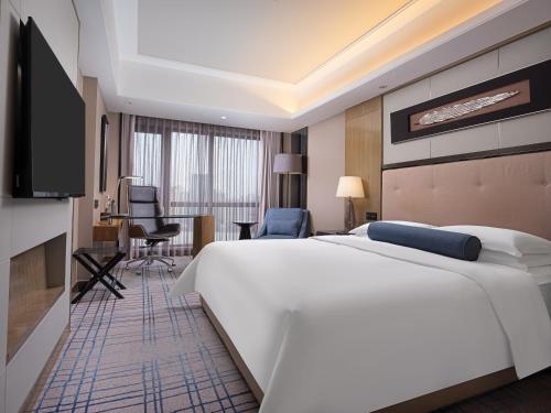 Habitación Clásica, 1 Cama King Size, Esquina del hotel Pullman Shanghai Jing An. Foto 5