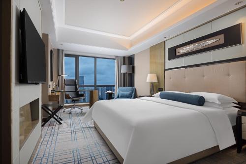 Habitación Clásica, 1 Cama King Size, Esquina del hotel Pullman Shanghai Jing An. Foto 8