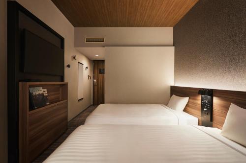 Habitación Doble - No fumadores - 2 camas del hotel Rihga Place Higobashi. Foto 8
