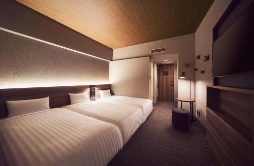Habitación Triple - No fumadores del hotel Rihga Place Higobashi. Foto 9