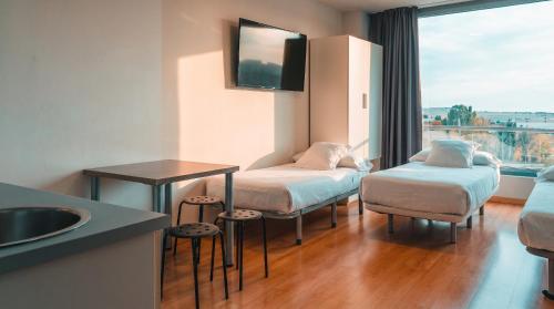 Habitación Familiar del hotel Vertice Roomspace Madrid. Foto 9