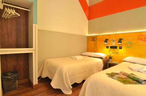 Habitación Doble con baño compartido - 2 camas del hotel Far Home Atocha. Foto 4