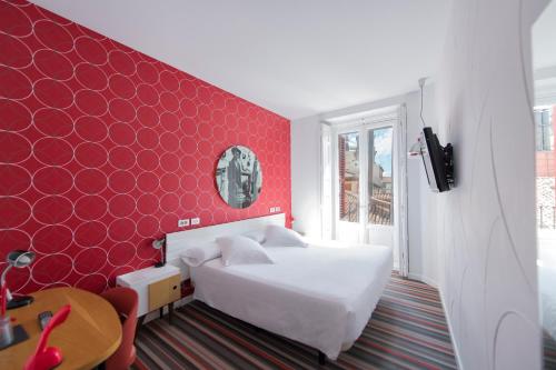 Habitación doble con balcón del hotel Posada Del Dragón Boutique. Foto 1