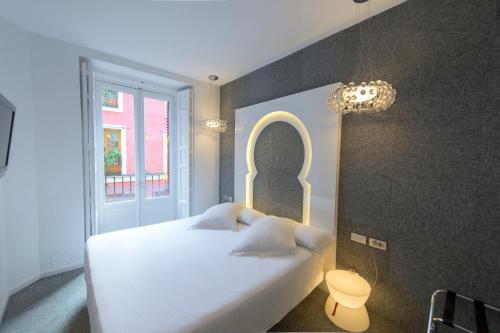 Habitación doble con balcón del hotel Posada Del Dragón Boutique. Foto 10