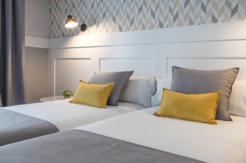 Habitación Triple del hotel Velázquez 45 by Pillow. Foto 2
