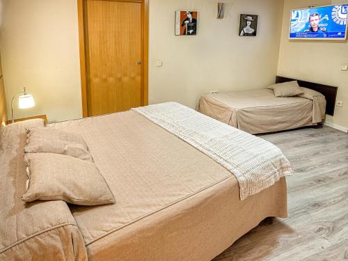 Habitación Triple Estándar del hotel Real Aranjuez. Foto 6