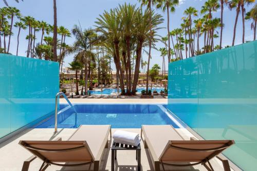 Habitación Doble con piscina privada del hotel Riu Palace Oasis. Foto 1