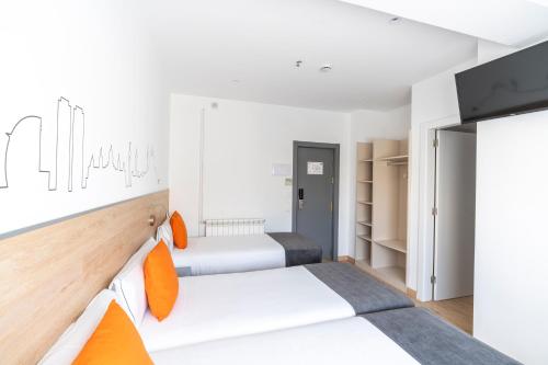 Habitación Doble con Cama supletoria del hotel Sans. Foto 2