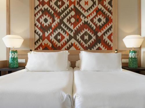 Habitación doble Vista Mar Lujo Vista Piscina 2 Camas individuales del hotel H10 Playa Meloneras Horizons Collection. Foto 2