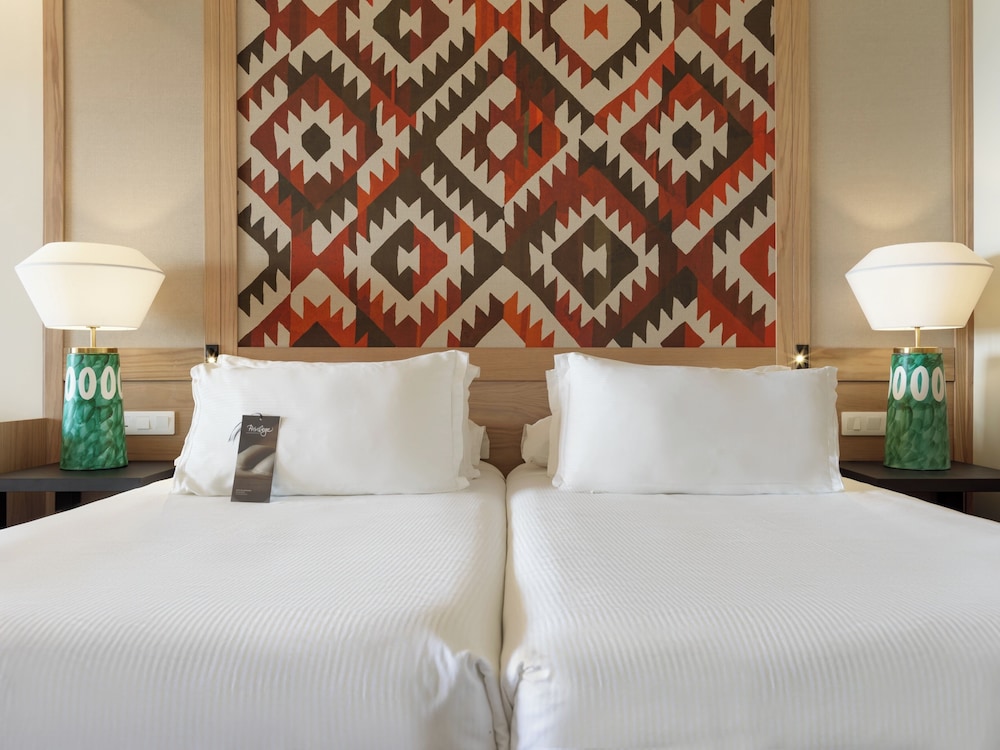 Habitación doble Balcón o Terraza Exclusive Sofá Cama incluido 2 Camas individuales del hotel H10 Playa Meloneras Horizons Collection. Foto 3