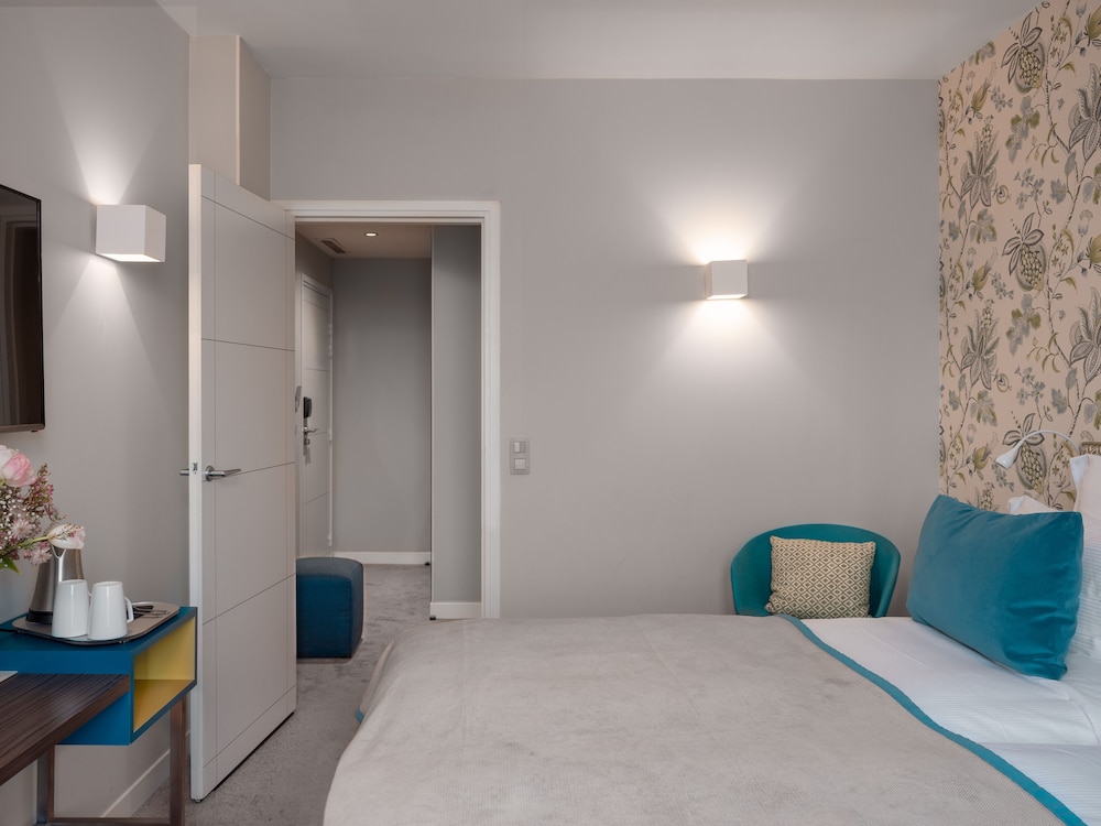 Habitación superior con 2 camas individuales del hotel Le Mareuil. Foto 1