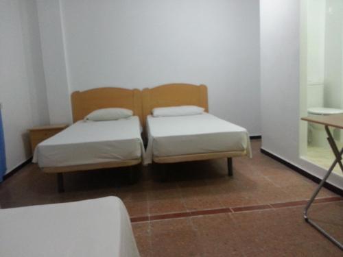 Habitación Triple con baño privado del hotel Casa De Huespedes San Fernando