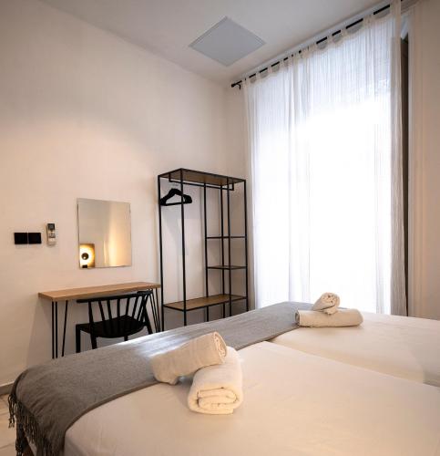 Habitación Doble - 2 camas del hotel La Central Sevilla. Foto 4