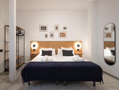 Habitación Triple del hotel La Central Sevilla. Foto 1