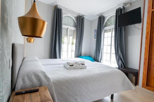 Habitación Doble con cama supletoria y baño privado - 2 camas del hotel La Muralla. Foto 1