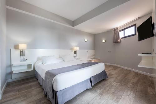 Habitación Familiar Deluxe del hotel Caserio. Foto 1