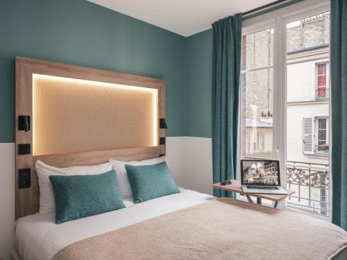 Habitación Doble Estándar con sofá cama del hotel Ibis Styles Montmartre Nord. Foto 5