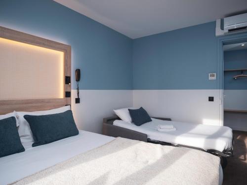 Habitación Doble Estándar con sofá cama del hotel Ibis Styles Montmartre Nord. Foto 7
