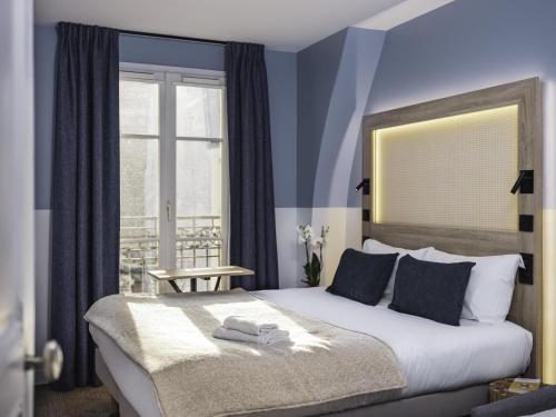 Habitación Doble Estándar con sofá cama del hotel Ibis Styles Montmartre Nord. Foto 8