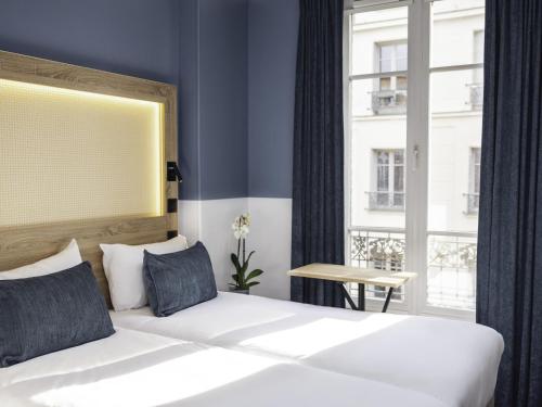 Habitación Doble Estándar - 2 camas del hotel Ibis Styles Montmartre Nord. Foto 6