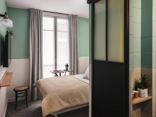 Habitación Doble Estándar - 2 camas del hotel Ibis Styles Montmartre Nord. Foto 7