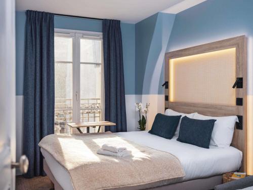 Habitación Doble Estándar con sofá cama del hotel Ibis Styles Montmartre Nord. Foto 10