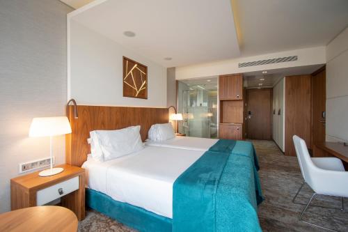 Habitación Doble Deluxe - 2 camas del hotel Epic Sana Lisboa. Foto 1