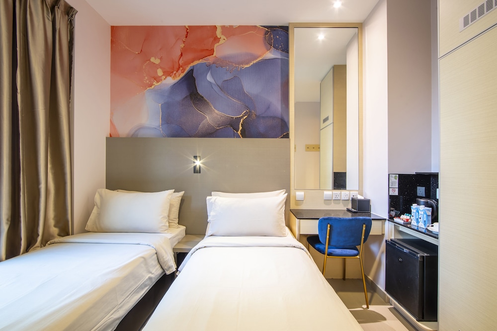 Habitación estándar con 2 camas individuales del hotel Ibis Styles Singapore Albert. Foto 2