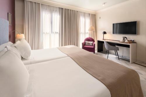 Habitación Vincci con cama supletoria del hotel Vincci Albayzin. Foto 2