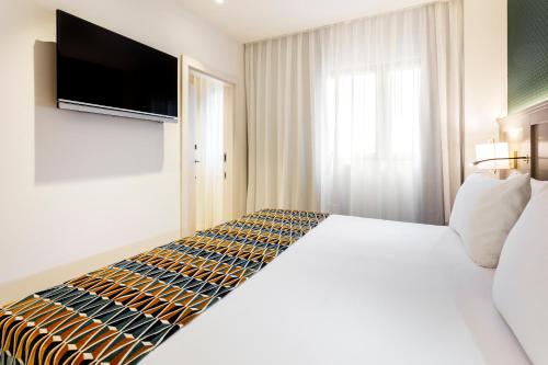 Habitación Familiar del hotel Eurostars Puerta Real. Foto 9