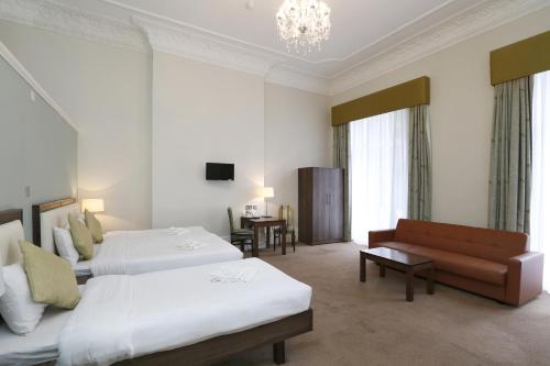 Habitación cuádruple del hotel Hyde Park Boutique. Foto 2