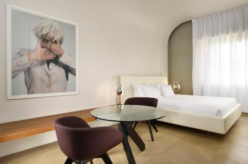 Suite Junior del hotel Palazzo Montemartini Rome, A Radisson Collection. Foto 2
