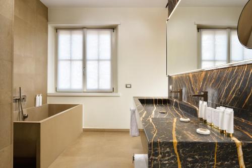 Habitación Premium Collection del hotel Palazzo Montemartini Rome, A Radisson Collection. Foto 1